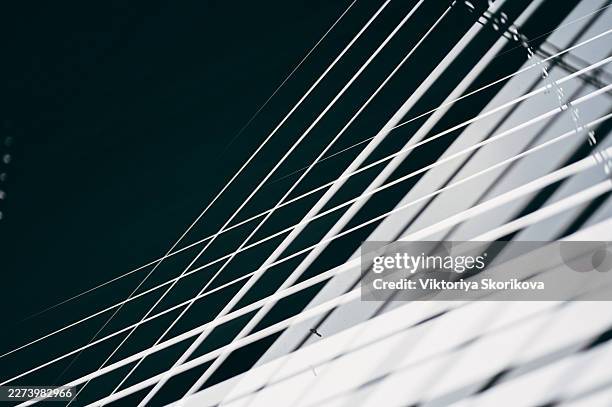 dramatic light rays through window blinds creating shadows. - light rays through window stock pictures, royalty-free photos & images