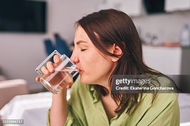 woman drinking fresh water for hydration and health - initiative stock pictures, royalty-free photos & images