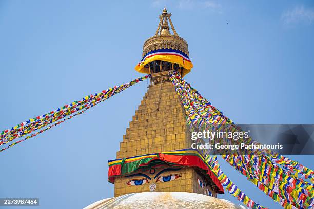 boudhanath buddhist stupa with prayer flags in kathmandu, nepal - shrine stock pictures, royalty-free photos & images