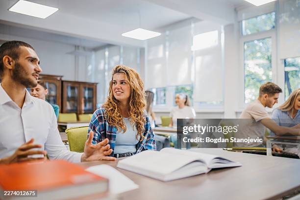 students interacting in a modern classroom setting - seminary stock pictures, royalty-free photos & images