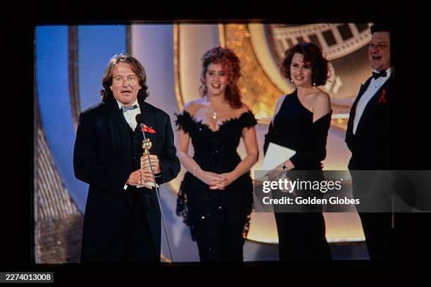 Robin Williams with Joely Fisher, Kate Nelligan and John Goodman at the 49th Annual Golden Globe Awards at the Beverly Hilton Hotel on January 18,...