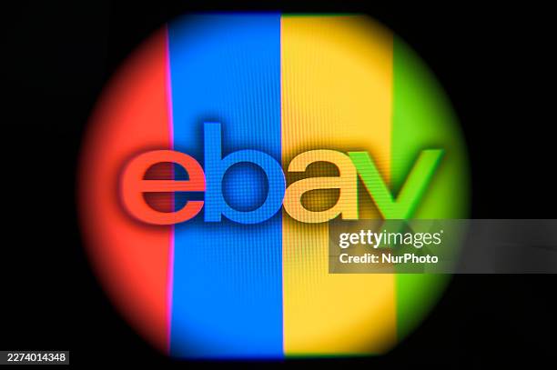 The eBay logo is displayed on a computer screen photographed through a magnifying glass in Creteil, France, on May 4, 2026. GameStop launches a...