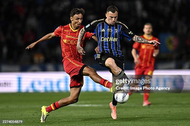 Filip Stojilkovic of Pisa competes for the ball with Tiago Gabriel of Lecce during the Serie A match between Pisa SC and US Lecce at Arena Garibaldi...