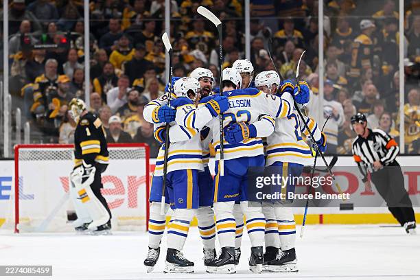 Mattias Samuelsson of the Buffalo Sabres celebrates with teammates after scoring a goal on Jeremy Swayman of the Boston Bruins during the first...