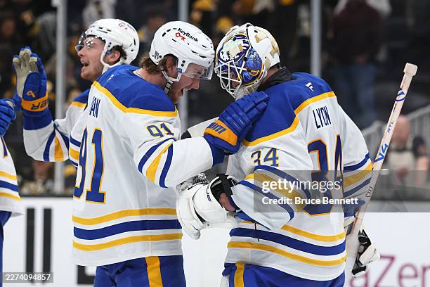 Josh Doan and Alex Lyon of the Buffalo Sabres celebrate after defeating the Boston Bruins with a score of 4 to 1 to win Game Six of the First Round...