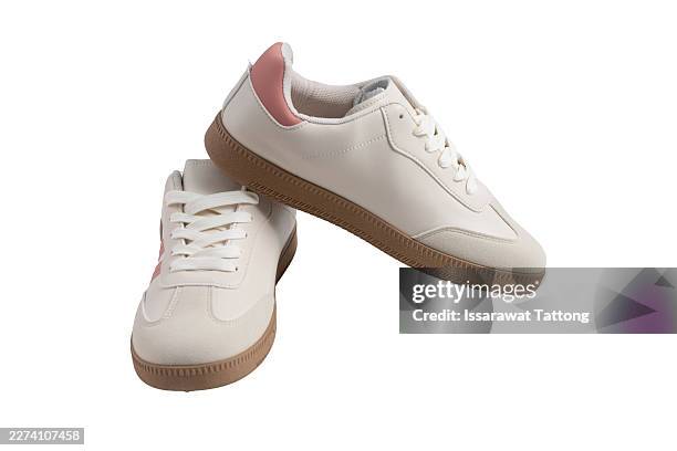 white sneakers with pink accents and brown soles - shoelace stock pictures, royalty-free photos & images