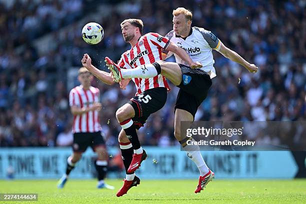 Patrick Bamford of Sheffield United is tackled by Sondre Langås of Derby County during the Sky Bet Championship match between Derby County and...
