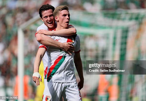 Anton Kade of FC Augsburg celebrates scoring his team's second goal with teammate Michael Gregoritsch during the Bundesliga match between SV Werder...