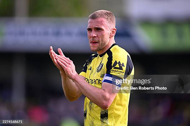 Jack Evans of Harrogate Town applauds the fans following the Sky Bet League Two match between Harrogate Town and Barnet FC at The EnviroVent Stadium...