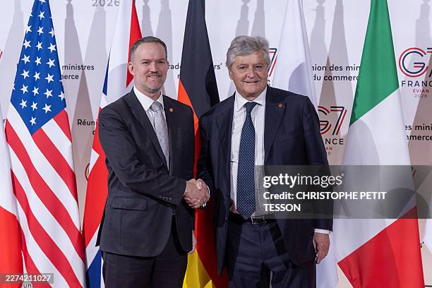 France's Trade Minister Nicolas Forissier shakes hands with US Trade Representative Jamieson Greer ahead of a meeting of the G7 countries in...