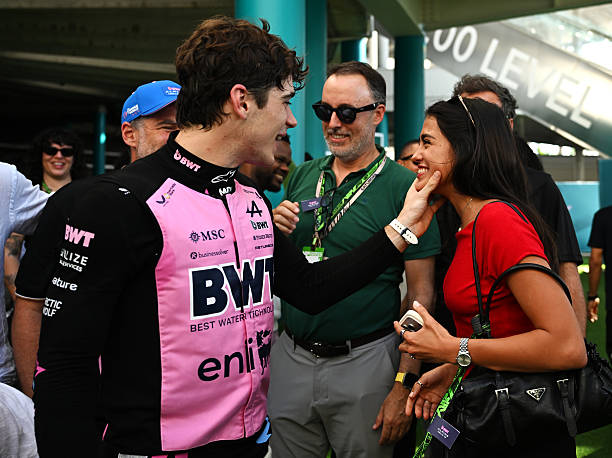Eighth placed qualifier Franco Colapinto of Argentina and Alpine F1 and Maia Reficco celebrate in parc ferme during qualifying ahead of the F1 Grand...
