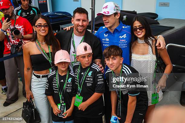 Franco Colapinto of Argentina and Alpine F1 Team poses for a photo with model Maia Reficco, professional footballler Lionel Messi, and family during...