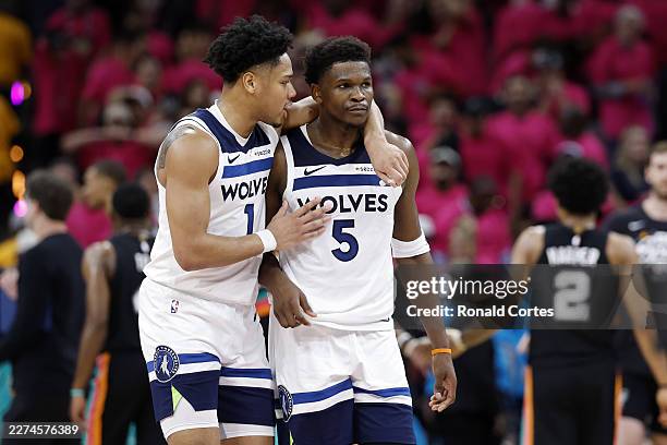 Terrence Shannon Jr. #1 and Anthony Edwards of the Minnesota Timberwolves look on during the second half of a game against the San Antonio Spurs in...