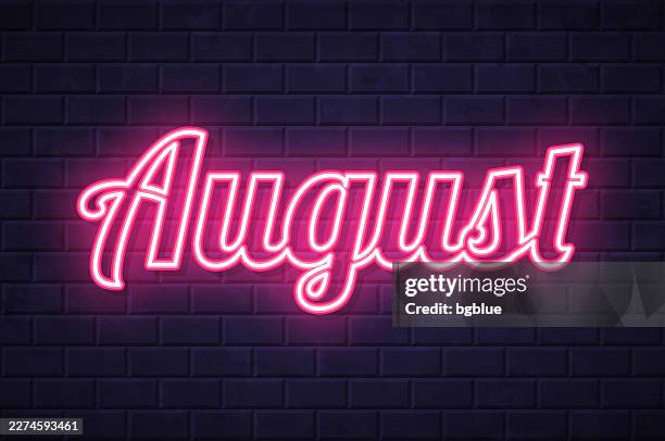 august - glowing neon text on brick wall background - august background stock illustrations