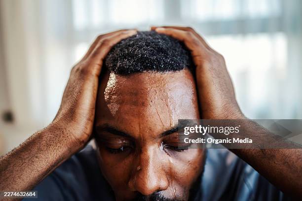 man experiencing severe headache from stress or heat - humidity stock pictures, royalty-free photos & images