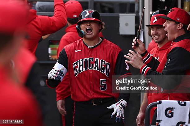 Munetaka Murakami of the Chicago White Sox celebrates with teammates in the dugout after hitting a home run during the first inning against the...