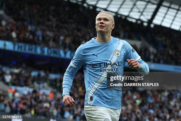 Manchester City's Norwegian striker Erling Haaland celebrates after scoring their second goal during the English Premier League football match...