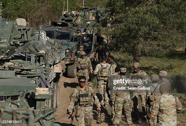 Soldiers of the U.S. Army 2nd Cavalry Regiment Stryker Brigade prepare to head out with their vehicles as they participate in the Amber Shock 26...