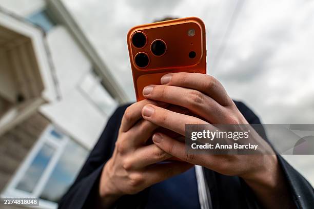 In this photo illustration a 15-year-old teenage boy looks at an iPhone smartphone screen on May 6, 2026 in Bath, England. In the UK, a ban on social...