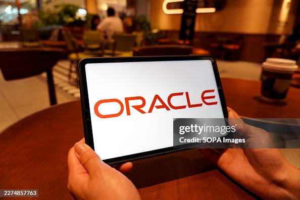 In this photo illustration, the Oracle logo is displayed on In this photo illustration, the Oracle logo is displayed on