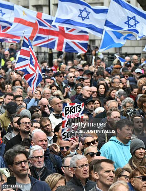 Person holds a placard during a rally organised by the Campaign Against Antisemitism, opposite Downing Street in central London on May 10, 2026.