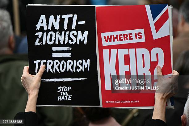 Person holds a placard during a rally organised by the Campaign Against Antisemitism, opposite Downing Street in central London on May 10, 2026.