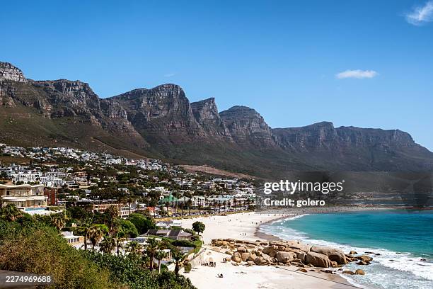 beach at camps bay in capetown - camps bay stock pictures, royalty-free photos & images