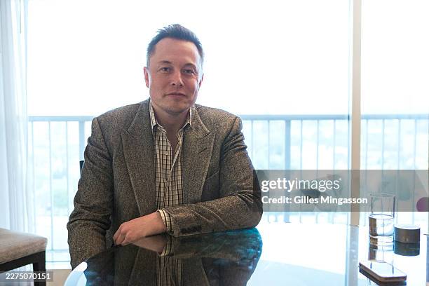 Elon Musk pauses in a hotel room during the Milken Institute Global Conference, on April 28 in Los Angeles, California..