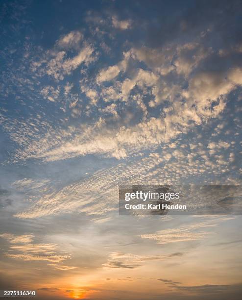 sun and cloud at sunset - dramatic cloudscape stock pictures, royalty-free photos & images