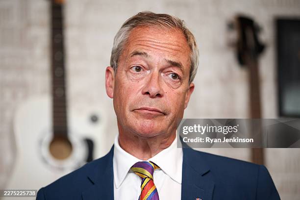 Reform UK leader Nigel Farage speaks to the media at The Dam Bar And Grill on May 08, 2026 in St Helens, England. Voters went to the polls yesterday...