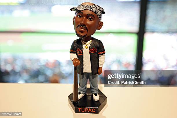 Tupac Shakur Baltimore Orioles bobblehead is seen on display as the promotional giveaway before the Orioles play against the Athletics at Oriole Park...
