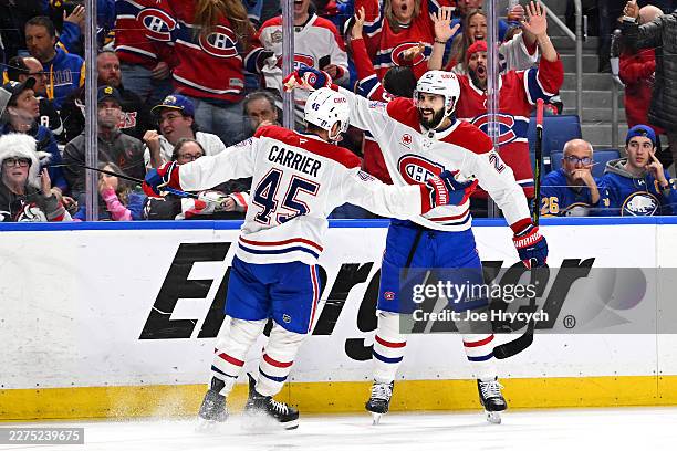 Alexandre Carrier of the Montréal Canadiens celebrates a goal with Phillip Danault of the Montréal Canadiens during the third period against the...