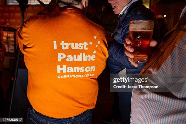 One Nation supporters celebrate as their party wins the Farrer by-election on May 9, 2026 in Albury, Australia. The May 9 contest, triggered by...