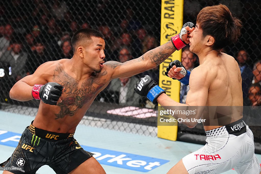 Joshua Van of Myanmar punches Tatsuro Taira of Japan in the UFC... News ...