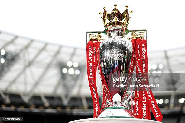 The Premier League Trophy is displayed inside the stadium prior to the Premier League match between West Ham United and Arsenal at London Stadium on...