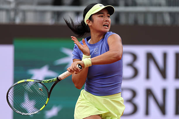 Alexandra Eala of Philippines plays a forehand against Elena Rybakina of Kazakhstan in their Round of 64 match on day Six of the Internazionali BNL...