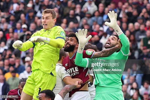 Pablo of West Ham United fouls David Raya of Arsenal resulting in a late equalising goal for West Ham being disallowed by VAR during the Premier...