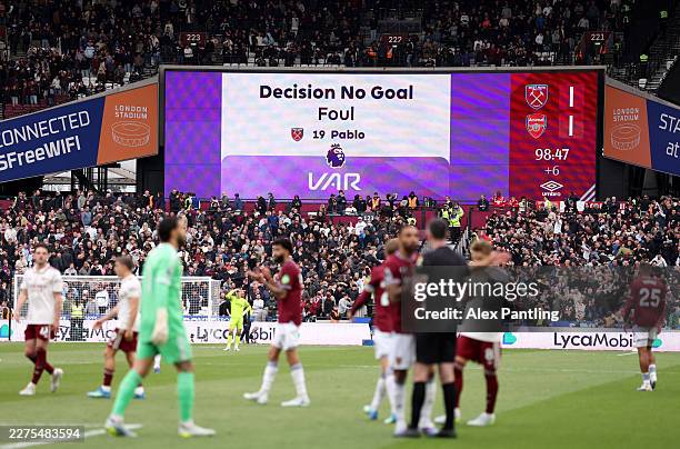 The LED board displays the VAR decision that disallowed the goal scored by Callum Wilson of West Ham United, after Pablo of West Ham United fouled...
