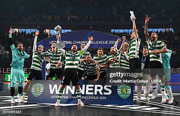 Joao Nuno Alves de Matos of Sporting Clube de Portugal lifts the Futsal Champions League Trophy with teammates after the UEFA Futsal Champions League...