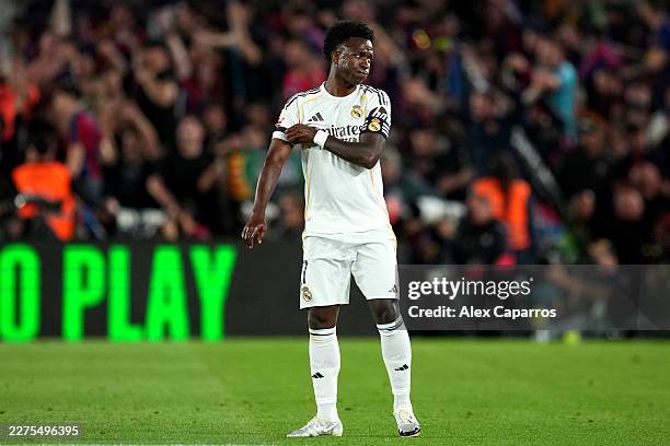 Vinicius Junior of Real Madrid looks dejected after Ferran Torres of FC Barcelona scores his team's second goal during the LaLiga EA Sports match...