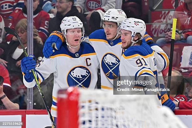 Tage Thompson of the Buffalo Sabres celebrates after scoring a goal against the Montreal Canadiens with Jiri Kulich and Josh Doan during the first...