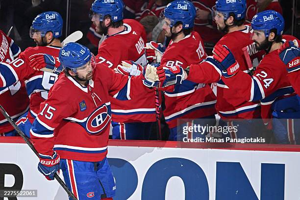 Alex Newhook of the Montreal Canadiens celebrates with teammates after scoring a goal against the Buffalo Sabres during the first period in Game...