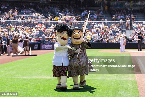 The San Diego Padres mascot Swinging Friar and the mother version of swinging Friar pose on the field for Mother's Day before the game against the...