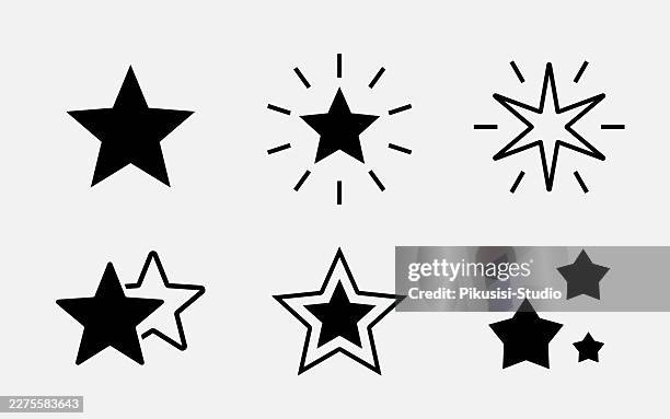 black sparkle star icon set isolated on white background - confetti flat lay stock illustrations