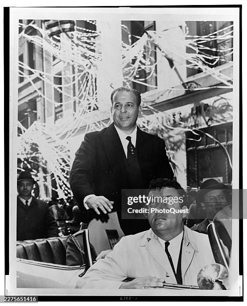 Brazilian President João Goulart stands in the back of a convertible during a ticket tape parade while on a State Visit, New York, New York, April 5,...
