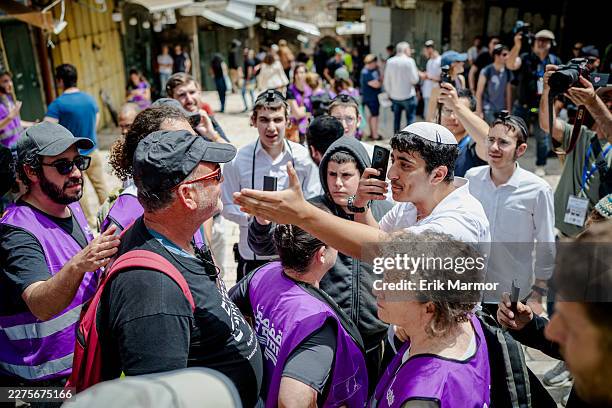 Right-wing settlers and left-wing activists engage in a heated confrontation during the Jerusalem Day celebrations on May 14, 2026 in the Old City of...