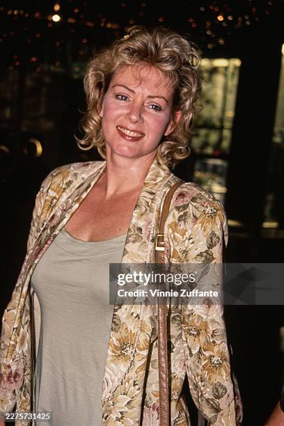 American actress Jean Smart, wearing a floral-pattern jacket over a grey outfit, attends the West Hollywood premiere of 'Mistress' at the DGA Theatre...