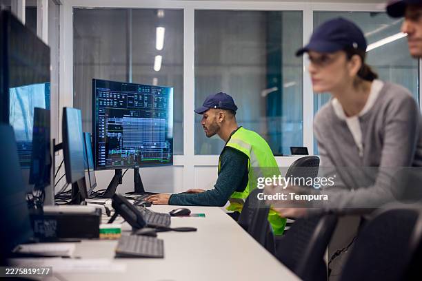 engineers are working in the factory's control room. - control room stock pictures, royalty-free photos & images