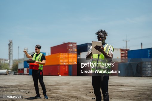 Logistics Operations Manager Analyzing Data On Tablet At Container Shipyard Supply Chain Efficiency Logistics Operations Manager Analyzing Data On Tablet At Container Shipyard Supply Chain Efficiency