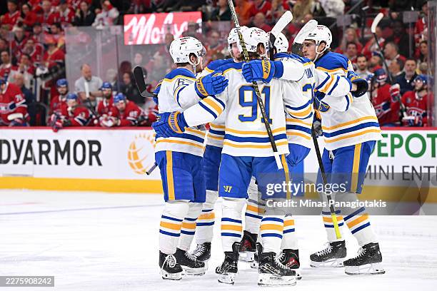 Zach Benson of the Buffalo Sabres celebrates with teammates after scoring a goal in the third period against the Montreal Canadiens in Game Four of...
